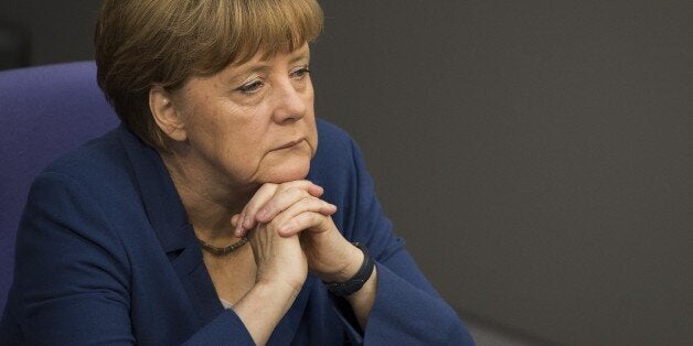 German Chancellor Angela Merkel attends a sitting of the Bundestag, Germany's lower house of parliament in Berlin on July 3,