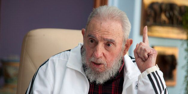 Cuba's Fidel Castro speaks with Russia's President Vladimir Putin in Havana, Cuba, Friday, July 11, 2014. Putin began a Latin American tour aimed at boosting trade and ties in the region with a stop Friday in Cuba, a key Soviet ally during the Cold War that has backed Moscow in its dispute with the West over Ukraine. (AP Photo/Alex Castro)