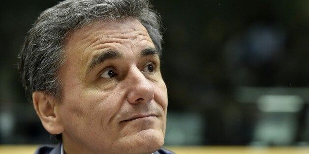 Newly appointed Greek Finance Minister Euclid Tsakalotos looks on during a Eurogroup meeting ahead of a Eurozone Summit meeti