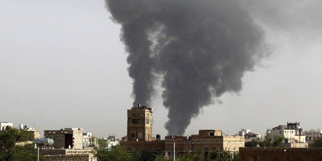 Smoke billows following air-strikes by the Saudi-led coalition on a weapons depot at a military airport, currently controlled by Yemeni Shiite Huthi rebels, on July 7, 2015 in the capital Sanaa. AFP PHOTO / MOHAMMED HUWAIS (Photo credit should read MOHAMMED HUWAIS/AFP/Getty Images)