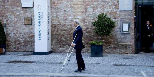 US State Secretary John Kerry speaks to his delegation after his press conference outside of the Palais Coburg Hotel where the Iran nuclear talks meetings are being held in Vienna, Austria on July 9, 2015. Global powers sought Thursday to ramp up pressure on Iran as they struggled to strike a long-sought nuclear accord, with one Iranian official admitting 'God only knows' if a deal was close. AFP PHOTO/JOE KLAMAR (Photo credit should read JOE KLAMAR/AFP/Getty Images)