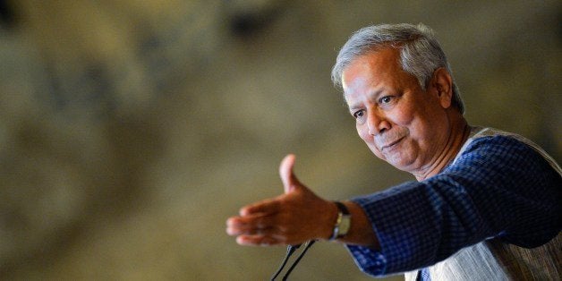 Bangladeshi Nobel Peace Prize winner and microcredit pioneer Muhammad Yunus gestures as he delivers a lecture entitled 'Social businness: sustainable solutions to the most pressing social challenges ' at Italy's Chamber of Deputies on July 10, 2014. AFP PHOTO / ANDREAS SOLARO (Photo credit should read ANDREAS SOLARO/AFP/Getty Images)