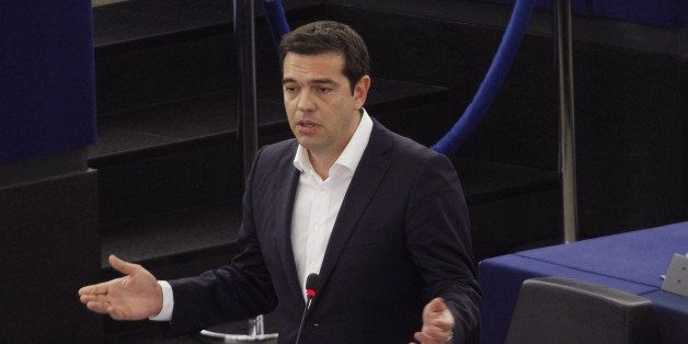 STRASBOURG, FRANCE - JULY 8: Greek Prime Minister Alexis Tsipras gestures as he speaks in the plenary hall at the European Parliament on July 8, 2015 in Strasbourg, France. Eurozone member nations have given Greece until Thursday to come up with new proposals to bring the country out of its debt crisis and qualify for further assistance from international creditors. Analysts say that should this final effort fail a departure of Greece from the Eurozone will be inevitable. (Photo by Michele Tantussi/Getty Images)