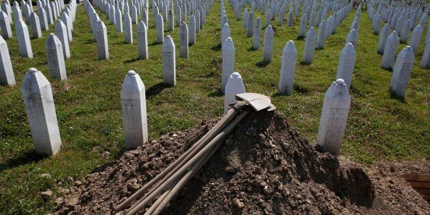 Shovels are stacked beside graves in Potocari near Srebrenica, 150 kms north east of Sarajevo, Bosnia, on Wednesday, July 8,2015. The memorial center in Potocari, is a cemetery for victims of the Srebrenica massacre who were killed in the summer of 1995 during the worst atrocity on European soil since the Second World War.(AP Photo/Amel Emric)