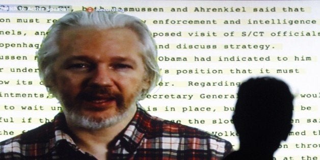 Founder of Wikileaks Julian Assange speaking from the Ecuadorean embassy in London appears on a screen as he gives a video co