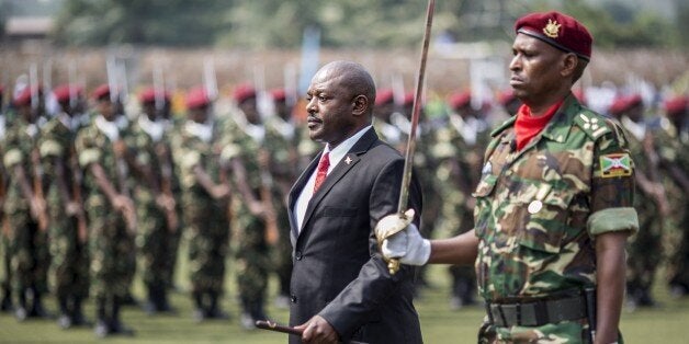 Burundi President Pierre Nkurunziza (C) reviews troops after arriving for the celebrations marking the 53rd anniversary of the country's Independence at the Prince Rwagasore stadium in Bujumbura on July 1, 2015. AFP PHOTO/MARCO LONGARI (Photo credit should read MARCO LONGARI/AFP/Getty Images)