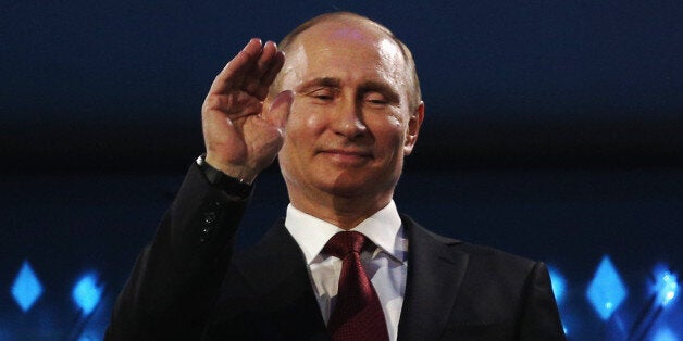 SOCHI, RUSSIA - MARCH 16: Russia President Vladimir Putin waves during the Sochi 2014 Paralympic Winter Games Closing Ceremony at Fisht Olympic Stadium on March 16, 2014 in Sochi, Russia. (Photo by Hannah Peters/Getty Images)