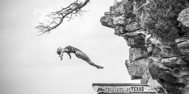 POSSUM KINGDOM LAKE, TEXAS - MAY 28: (EDITORIAL USE ONLY) In this handout image provided by Red Bull, Lysanne Richard of Canada dives from the 20 metre platform during the third stop of the Red Bull Cliff Diving World Series, Possum Kingdom Lake, Texas, USA. (Photo by Romina Amato/Red Bull via Getty Images)