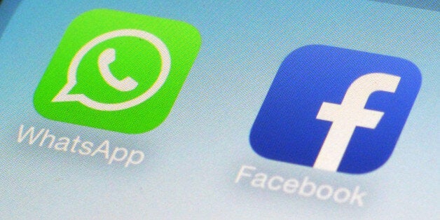FILE - This Feb. 19, 2014 file photo shows WhatsApp and Facebook app icons on a smartphone in New York. One sign of the growi