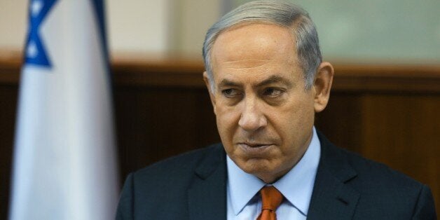 Israeli Prime Minister Benjamin Netanyahu chairs the weekly cabinet meeting at his Jerusalem office on June 28, 2015. AFP PHOTO / POOL / ATEF SAFADI (Photo credit should read POOL/AFP/Getty Images)