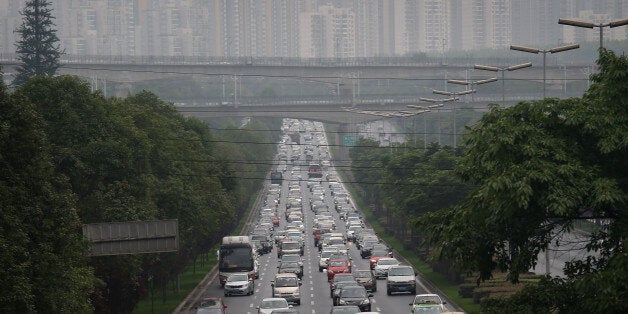 CHENGDU, CHINA - JUNE 30: Commuter traffic flows from a skyline of apartment buildings on June 30, 2015 in Chengdu, China. First inhabited more than 4 thousand years ago, Chengdu now has more than 14 million people living in its metropolitan area. It is China's 5th most populous city and the provincial capital of Sichuan Province in southwest China. The city is is struggling to maintain its ancient cultural identity, while becoming a modern major tech and industrial center. (Photo by John Moore/Getty Images)