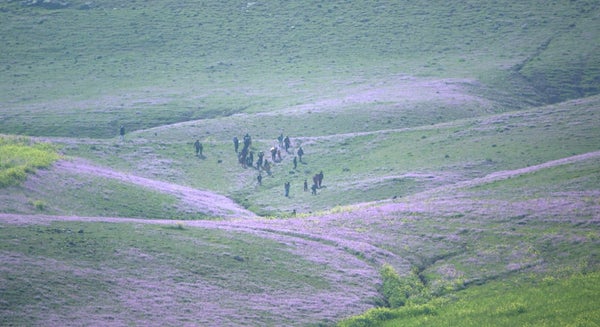 The group of kidnapped people escaping across the frontline from ISIS-controlled territory near the Sinjar mountain