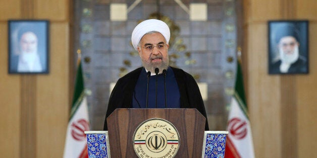 Iran's President Hassan Rouhani addresses the nation in a televised speech after a nuclear agreement was announced in Vienna, in Tehran, Iran, Tuesday, July 14, 2015. Rouhani said "a new chapter" has begun in his nation's relations with the world. He maintained that Iran had never sought to build a bomb, an assertion the U.S. and its partners have long disputed. (AP Photo/Ebrahim Noroozi)