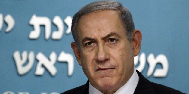 Israeli Prime Minister Benjamin Netanyahu delivers a statement in his office in Jerusalem on July 14, 2015, after world powers reached a historic nuclear deal with Iran. Netanyahu said after the deal was reached that Israel was not bound by it and signalled he remained ready to order military action . AFP PHOTO / THOMAS COEX (Photo credit should read THOMAS COEX/AFP/Getty Images)