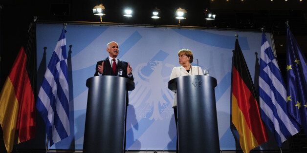 German Chancellor Angela Merkel and Greek Prime Minister George Papandreou give a statement on September 27, 2011 in Berlin. Greece's prime minister lashed out before at critics that say his country is not reforming fast enough and vowed he would continue to make the efforts required to tackle its crippling debt crisis. AFP PHOTO JOHN MACDOUGALL (Photo credit should read JOHN MACDOUGALL/AFP/Getty Images)