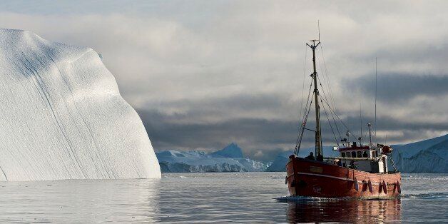 GREENLAND - AUGUST 02: Ship among the icebergs that have broken off the Sermeq Kujalleq ice sheet, Ilulissat, Qaasuitsup, Greenland. (Photo by DeAgostini/Getty Images)
