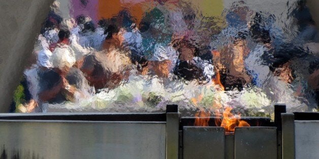 People visit the Peace Memorial Park to pray for victims of the atomic bombing in Hiroshima on August 5, 2015. The Japanese w