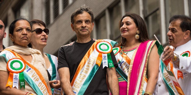 NEW YORK, NY - AUGUST 17: Vivek RanadivÃ© of the Sacramento Kings rides on the float during the India Day Parade on August 17, 2014 in New York, New York. NOTE TO USER: User expressly acknowledges and agrees that, by downloading and or using this photograph, User is consenting to the terms and conditions of the Getty Images License Agreement. Mandatory Copyright Notice: Copyright 2014 NBAE (Photo by Michael LeBrecht/NBAE via Getty Images)