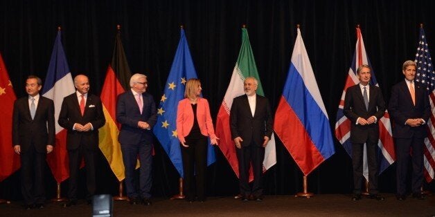 VIENNA, AUSTRIA - JULY 14: (R-L) US Secretary of State John Kerry, British Foreign Secretary Philip Hammond, Iran's Foreign Minister Javad Zarif, High Representative of the European Union for Foreign Affairs and Security Policy Federica Mogherini, German Minister for Foreign Affairs Frank-Walter Steinmeier, French Foreign Minister Laurent Fabius and China's Foreign Minister Wang Yi poses for a family shoot after they concluded the Iran nuclear talk meetings with a deal in Vienna, Austria on July 14, 2015. (Photo by Hasan Tosun/Anadolu Agency/Getty Images)