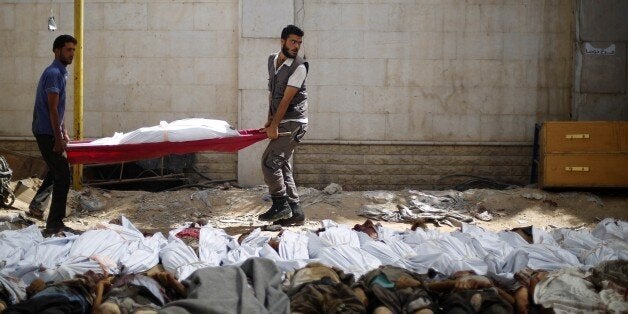 DAMASCUS, SYRIA - AUGUST 16: Bodies of Syrians seen after Assad regime forces vacuum bomb air-strike staged to a marketplace
