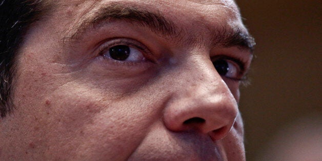 Alexis Tsipras, Greece's prime minister, pauses during a central committee meeting of the Syriza party in Athens, Greece, on Thursday, July 30, 2015. Tsipras confronted rebels within his own party for not backing his deal with creditors, in a showdown that could put Europe's most indebted state on course for snap elections. Photographer: Kostas Tsironis/Bloomberg via Getty Images 