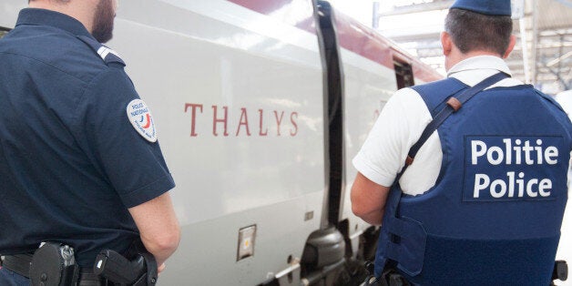 Member of belgian and french police stay next to a Thalys train at the Brussels Midi - Zuid train station, on Saturday, Aug. 22, 2015. Security has become more visible after an attack on Friday of a Thalys train traveling from Amsterdam to Paris. (AP Photo/Francois Walschaerts)