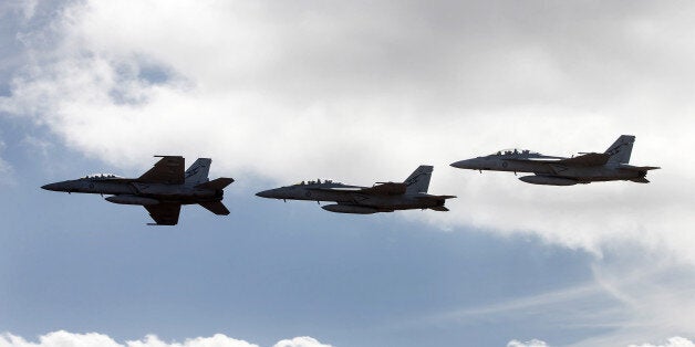 Royal Australian Air Force (RAAF) F/A-18F Super Hornet fighter jets manufactured by Boeing Co. fly in formation during the Au