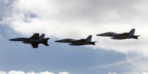 Royal Australian Air Force (RAAF) F/A-18F Super Hornet fighter jets manufactured by Boeing Co. fly in formation during the Australian International Airshow and Aerospace & Defence Exposition at Avalon Airport in Geelong, Australia, on Tuesday, Feb. 24, 2015. The Avalon Airshow runs until March 1. Photographer: Mark Dadswell/Bloomberg via Getty Images