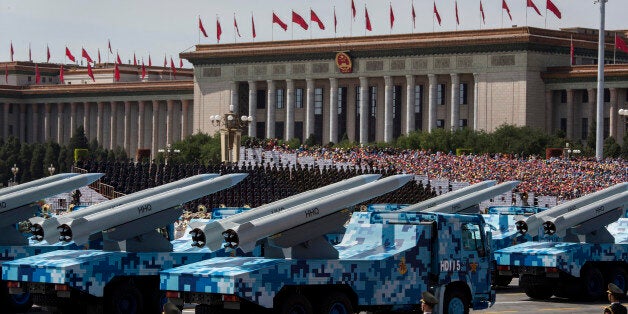 BEIJING, CHINA - SEPTEMBER 03: Chinese missiles are seen on trucks as they drive next to Tiananmen Square and the Great Hall of the People during a military parade on September 3, 2015 in Beijing, China. China is marking the 70th anniversary of the end of World War II and its role in defeating Japan with a new national holiday and a military parade in Beijing. (Photo by Kevin Frayer/Getty Images)