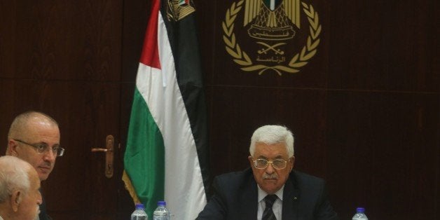 RAMALLAH, WEST BANK - SEPTEMBER 1 : Palestinian President Mahmoud Abbas (R) and Palestinian Prime Minister Rami Hamdallah (2