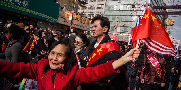 NEW YORK, NY - FEBRUARY 02: People participate in the Chinese New Year Parade on February 2, 2014 in the Chinatown neighborhood of New York City. The parade, which is in it's 15th year in New York, brought out thousands of participants and viewers. (Photo by Andrew Burton/Getty Images)