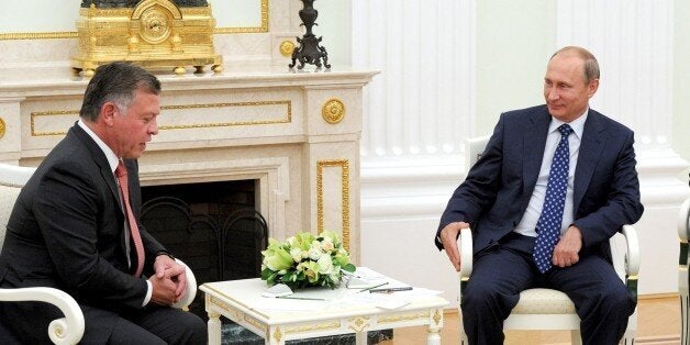 MOSCOW, RUSSIA - AUGUST 25: King Abdullah II of Jordan (L) speaks with Russian President Vladimir Putin (R) during their meeting at the Moscow International Aviation and Space Salon MAKS-2015 in the city of Zhukovsky, outside Moscow on August 25, 2015. The International Aviation and Space Salon MAKS 2015 take place from 25 to 30 August. (Photo by Kremlin Press Center /Anadolu Agency/Getty Images)