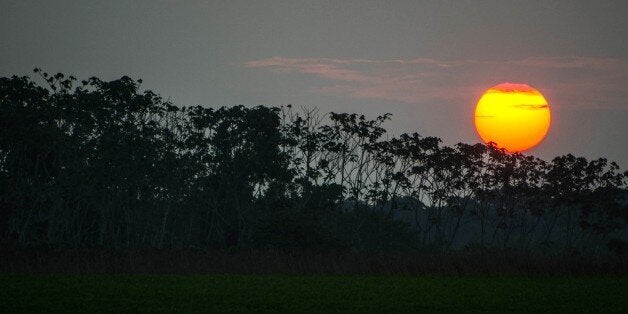 Picture taken during sunset in Carauari, a town on the banks of the Jurua river in the Brazilian state of Amazonas, some 540 km from the state capital Manaus, on August 21, 2015. AFP PHOTO / NELSON ALMEIDA (Photo credit should read NELSON ALMEIDA/AFP/Getty Images)