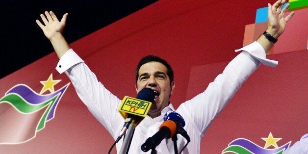 Syriza leader Alexis Tsipras celebrates with supporters after his party's victory in the Greek general elections at his campa