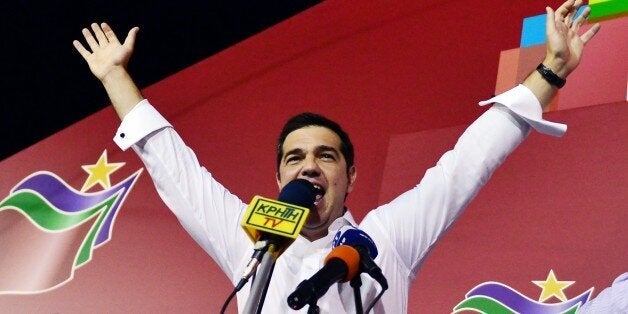 Syriza leader Alexis Tsipras celebrates with supporters after his party's victory in the Greek general elections at his campaign headquarters in Athens on September 20, 2015. With over half of the votes counted, Tsipras' Syriza party won 35.54 percent of the vote against 28.07 percent for conservative New Democracy and is likely to again form a coalition government with the nationalist Independent Greeks party. AFP PHOTO/ LOUISA GOULIAMAKI (Photo credit should read LOUISA GOULIAMAKI/AFP/Getty Images)