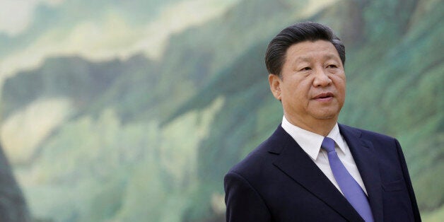 Chinese President Xi Jinping stands during a meeting with U.S. National Security Advisor Susan Rice at the Great Hall of the People in Beijing Friday, Aug. 28, 2015. Rice met with Xi amid final preparations for the Chinese leader's visit to Washington next month, with both sides expressing optimism despite their differences. (Jason Lee/Pool Photo via AP)