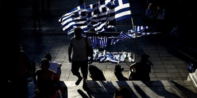 Greek flags stand for sale before the main pre-election rally of the Radical Left party SYRIZA in central Athens Syntagma squ