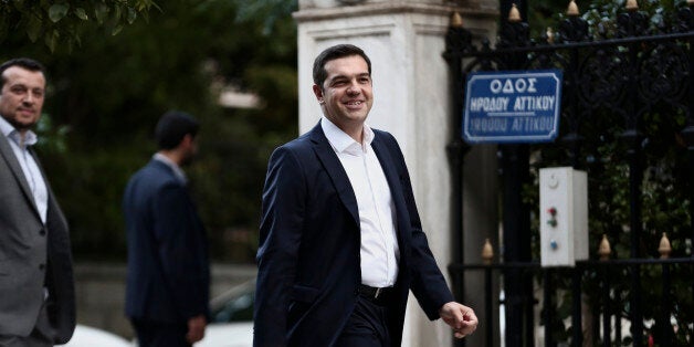 Alexis Tsipras, Greece's incoming prime minister and leader of the Syriza party, arrives at the presidential palace in Athens, Greece, on Monday, Sept. 21, 2015. With Syriza set to fall short of a majority in the 300-seat parliament, Tsipras, 41, will enter negotiations to build a viable government with the same coalition partner as before, scotching expectations he might do a deal with a more moderate party. Photographer: Yorgos Karahalis/Bloomberg via Getty Images 