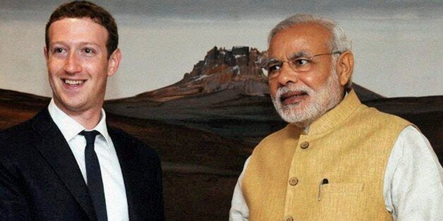 Indian Prime Minister Narendra Modi, right, shakes hands with Facebook CEO Mark Zuckerberg during a meeting in New Delhi, India, Friday, Oct. 10, 2014. (AP Photo/Press Trust of India) INDIA OUT