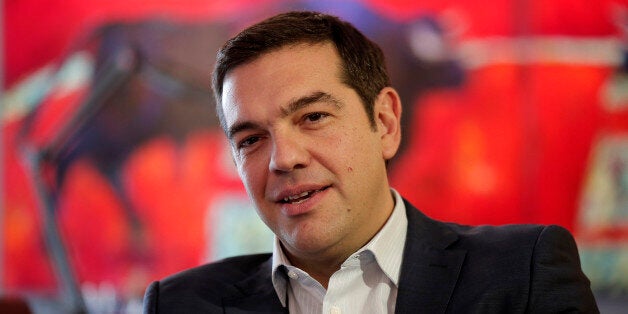 Left-wing Syriza party leader Alexis Tsipras speaks with leader of the right-wing Independent Greeks party Panos Kammenos dur