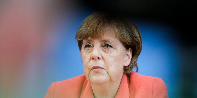 German Chancellor Angela Merkel attends her annual summer news conference in Berlin, Monday, Aug. 31, 2015. (AP Photo/Gero Breloer)