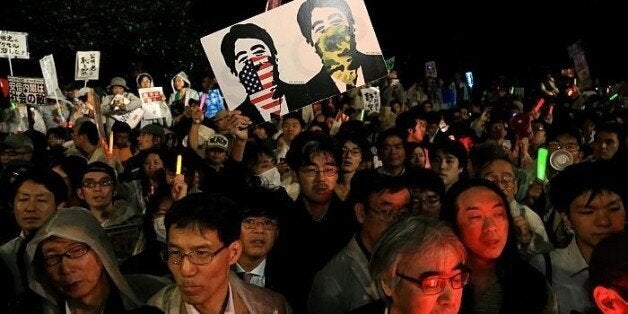TOKYO, JAPAN - SEPTEMBER 17: People protest against the new Japan Security Bill on September 17, 2015 in Tokyo, Japan. Hundr