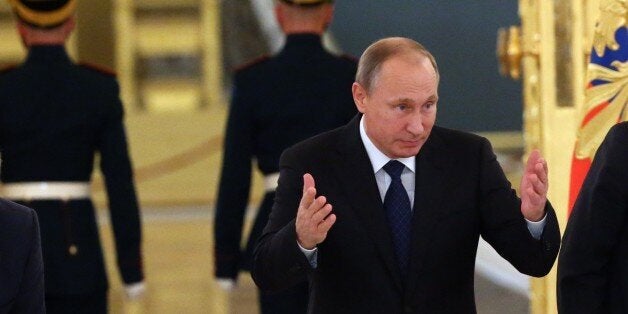 MOSCOW, RUSSIA - OCTOBER 1: Russian President Vladimir Putin arrives to speak at the Presidential Council for Civil Society and Human Rights meeting at the Alexadrovsky hall in the Grand Kremlin Palace October 1, 2015 in Moscow, Russia. Russia said 30 September that it had begun airstrikes against the Islamic State terrorist group in war-torn Syria, but the Syrian opposition alleged that the raids had hit territory held by other rebel groups and killed civilians (Photo by Sasha Mordovets/Getty Images)