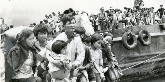 VUNG TAU , VIETNAM - APRIL,1975: Refugees from Da Nang and Hue, north of Saigon, pour ashore from navy barges at Vung Tau, south of Saigon. (Jack Cahill/Toronto Star via Getty Images)