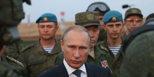 ORENBURG, RUSSIA- SEPTEMBER 19: Russian President Vladimir Putin talks to officers as he is visiting the Center -2015 Militar