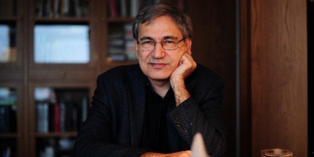 TO GO WITH AFP STORY BY PHILIPPE ALFROY Turkish Nobel laureate author Orhan Pamuk poses during an interview at his house in Istanbul on Febuary 2, 2015. World acclaimed Turkish writer Orhan Pamuk has started to work on his new novel featuring Istanbul in his flat overlooking the Bosphorus, Topkapi Palace and the Blue Mosque. Since he was awarded the Nobel Prize in 2006, he's become one of the most vocal critic of the 'climate of fear' he said conservative and Islamic Turkish President Recep Tayyip Erdogan imposed on Turkey. AFP PHOTO/OZAN KOSE (Photo credit should read OZAN KOSE/AFP/Getty Images)