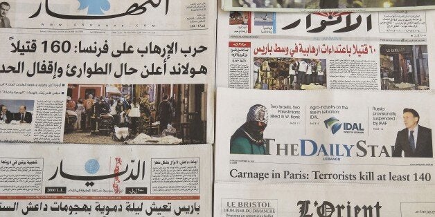 A photo taken on November 14, 2015 in the Lebanese capital Beirut shows newspapers bearing the headlines of the deadly Paris attack. French President Francois Hollande declared three days of national mourning following the attacks on November 13, targeting a concert hall and several bars and restaurants in eastern Paris, as well as the Stade de France national stadium north of the centre. AFP PHOTO / ANWAR AMRO (Photo credit should read ANWAR AMRO/AFP/Getty Images)