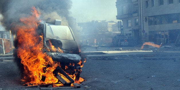 Burning van with large flames and black smoke
