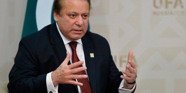 Prime Minister of Pakistan Nawaz Sharif gestures while speaking to Russian President Vladimir Putin during the SCO (Shanghai Cooperation Organization) summit in Ufa, Russia, Friday, July 10, 2015. (Host photo agency/RIA Novosti Pool Photo via AP)