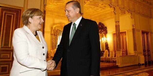 ISTANBUL, TURKEY - OCTOBER 18: German Chancellor Angela Merkel (L) shakes hands with Turkey's President Recep Tayyip Erdogan at the Yildiz Palace State apartments during her visit in Istanbul, Turkey on October 18, 2015. (Photo by Turkish Presidency / Murat Cetinmuhurdar/Anadolu Agency/Getty Images)